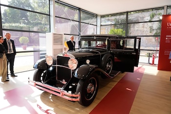 A popemobile used by successive popes is displayed at "A Century of the Popemobile," an exhibition tracing 100 years of papal transportation, from Pope Pius XI's first automobile in 1930 to modern popemobiles, at the Vatican Museums