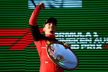 Formula One F1 - Australian Grand Prix - Melbourne Grand Prix Circuit, Melbourne, Australia - April 10, 2022 Ferrari's Charles Leclerc celebrates on the podium after winning the race REUTERS/Martin Keep TPX IMAGES OF THE DAY