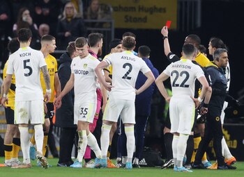 Soccer Football - Premier League - Wolverhampton Wanderers v Leeds United - Molineux Stadium, Wolverhampton, Britain - March 18, 2022 Wolverhampton Wanderers' Raul Jimenez is shown a red card by referee Kevin Friend Action Images via Reuters/Paul Childs EDITORIAL USE ONLY. No use with unauthorized audio, video, data, fixture lists, club/league logos or 'live' services. Online in-match use limited to 75 images, no video emulation. No use in betting, games or single club /league/player publications. Please contact your account representative for further details.