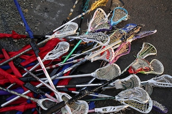A pile of Lacrosse sticks