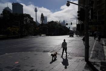A pedestrian wearing a face