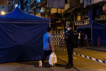 A resident carrying daily necessities