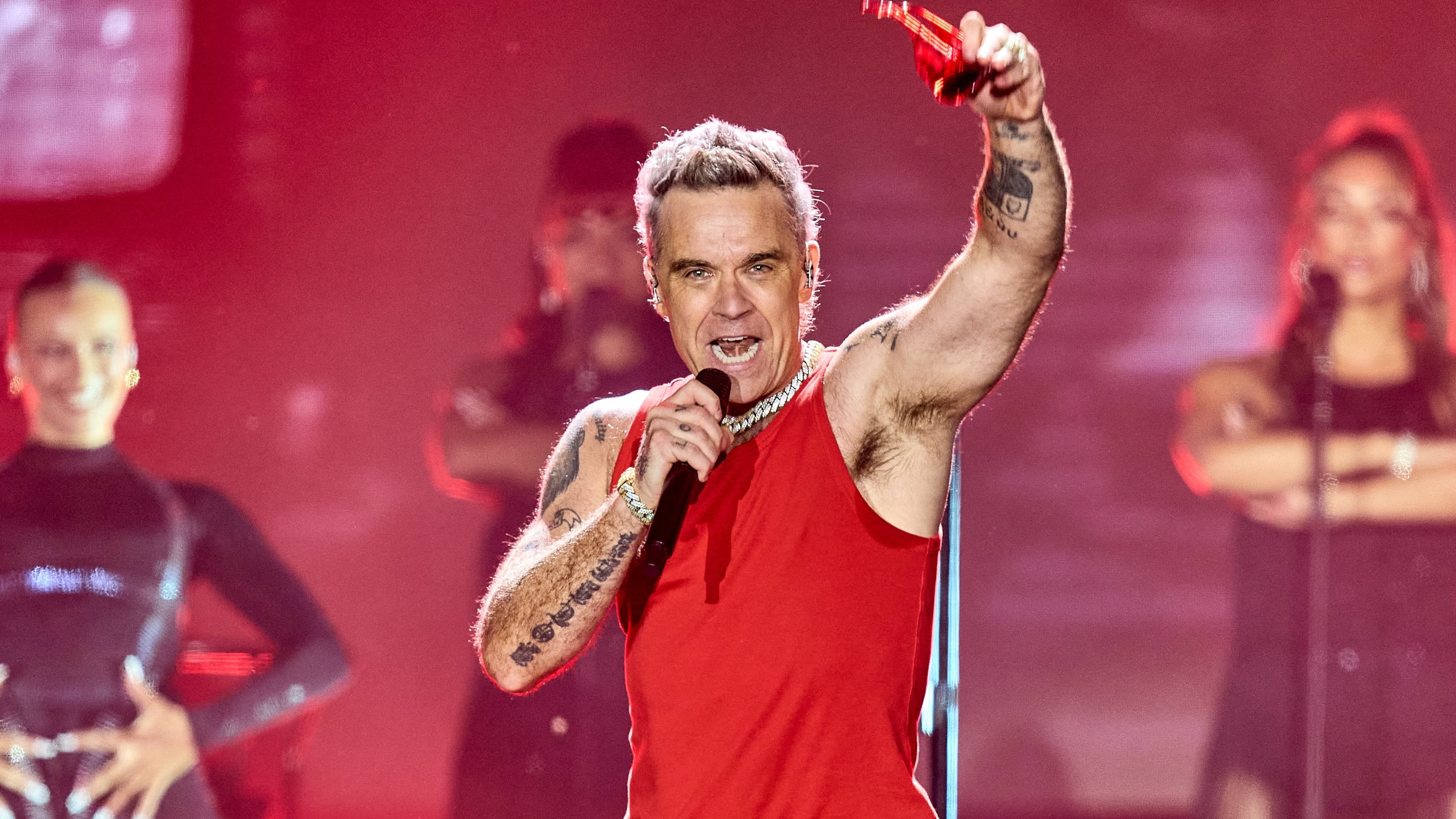British singer Robbie Williams performs at Smukfest in Skanderborg,Denmark, August 5, 2026. Ritzau Scanpix/Mikkel Berg Pedersen via REUTERS ATTENTION EDITORS - THIS IMAGE WAS PROVIDED BY A THIRD PARTY. DENMARK OUT. NO COMMERCIAL OR EDITORIAL SALES IN DENMARK.