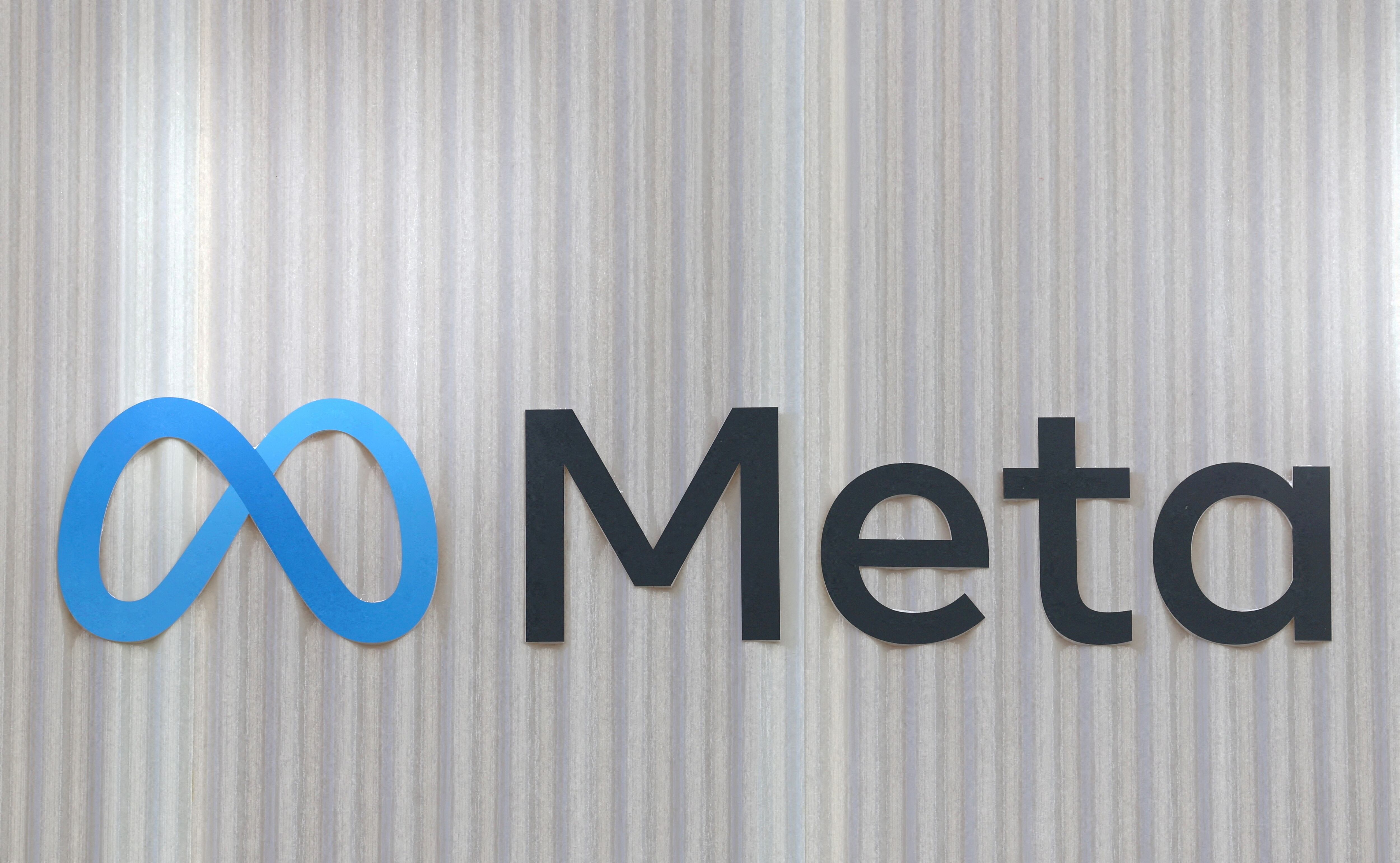 FILE PHOTO: The logo of Meta is seen at the entrance of the company