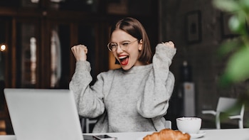 Happy woman in glasses makes
