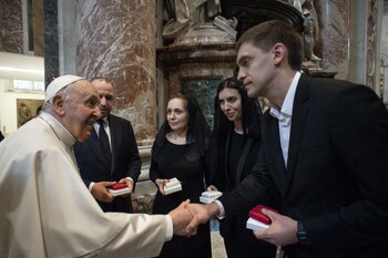 Pope Francis shakes hands with