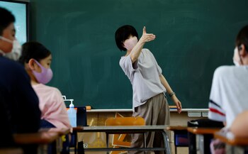 A teacher gives a lecture