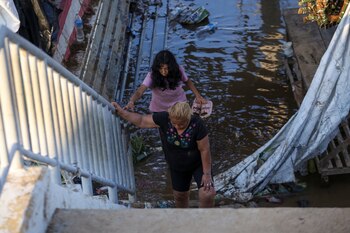 People climb stairs as they