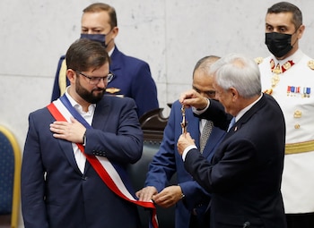 Gabriel Boric gestures after being