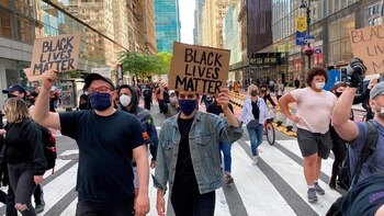 Hundreds of people protest during