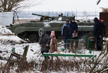 Local residents are seen near