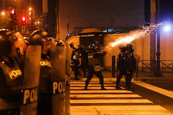 Police confront demonstrators protesting to demand the dissolution of Congress and to hold democratic elections rather than recognize Dina Boluarte as Peru's President, after the ousting of Peruvian President Pedro Castillo, in Lima, Peru December 12, 2022. REUTERS/Sebastian Castaneda