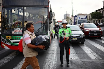 A transit police gestures on the road, as the city of Lima gets ready for the APEC forum, in Peru November 11, 2024. REUTERS/Agustin Marcarian REFILE - QUALITY REPEAT