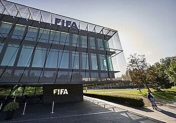 A journalist stands in front