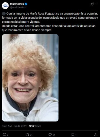 Retrato de María Rosa Fugazot, una mujer mayor con cabello rubio rizado, sonriendo ampliamente, vestida con una chaqueta blanca sobre una prenda oscura