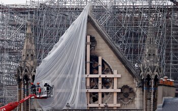 Workers prepare to remove damaged