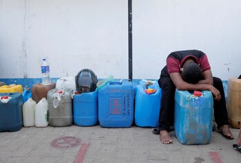 A man rests while waiting in a line to buy diesel near a Ceylon Petroleum Corporation fuel station, amid the country's economic crisis in Colombo, Sri Lanka, April 7, 2022. REUTERS/Dinuka Liyanawatte