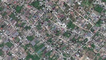 Una imagen de satélite muestra una vista general de la ciudad de Oleshky antes del derrumbamiento de la presa de Kakhovka, el 15 de mayo de 2023 (Maxar/Reuters)