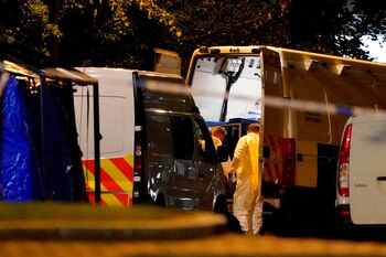 Forensic officers work close to