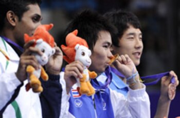 SINGAPORE,19 Aug 2010 - The silver medallist HASEENA SUNIL KUMAR Prannoy of India, the gold medallist POODCHALAT Pisit of Thailand and the bronze medallist KANG Ji Wook of South Korea (L-R) pose together during the awarding ceremony of the boys' singles final match of badminton at the Singapore 2010 Youth Olympic Games in Singapore, August 19, 2010.