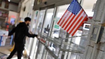Supermarket employee guards against federal immigration authorities in North Carolina