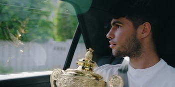 Carlos Alcaraz with one of