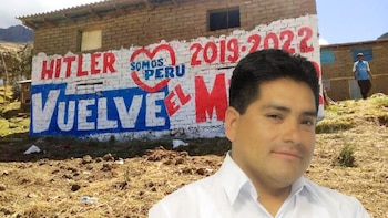 Retrato del político Hitler Alba sobre un mural con propaganda electoral pintado en la fachada de una casa rural de ladrillos