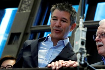 FILE PHOTO: Former Uber Technologies Inc. CEO and co-founder Travis Kalanick stands on a balcony above the trading floor of the New York Stock Exchange (NYSE) during the company's IPO in New York, U.S., May 10, 2019. REUTERS/Andrew Kelly/File Photo