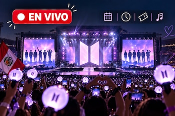 Escenario iluminado con el logotipo de BTS y siluetas humanas, rodeado por un público que sostiene linternas esféricas y una bandera de Perú