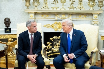 FILE — President Donald Trump, right, meets with Prime Minister Mark Carney of Canada in the Oval Office of the White House in Washington, Oct. 7, 2025. Prime Minister Carney has spent most of his tenure cultivating Canada’s trade, defense and investment relationships with Asia and Europe. (Haiyun Jiang/The New York Times)