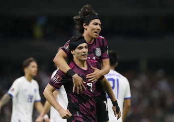 Soccer Football - World Cup - Concacaf Qualifiers - Mexico v El Salvador - Estadio Azteca, Mexico City, Mexico - March 30, 2022 Mexico's Raul Jimenez celebrates scoring their second goal with Erick Gutierrez REUTERS/Edgard Garrido