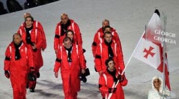 The Georgia delegation, wearing black armbands in honor of Luger Nodar Kumaritashvili, enter the stadium during the opening ceremonies at the BC Place for the XXI Winter Olympic Games February 12, 2010 in Vancouver British Columbia, Canada. Luger Nodar Kumaritashvili of Georgia was killed on February 12 after crashing while making a practice run in training. AFP PHOTO/Leon NEAL (Photo credit should read LEON NEAL/AFP/Getty Images)