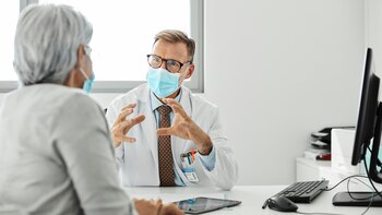 Doctor discussing with female patient