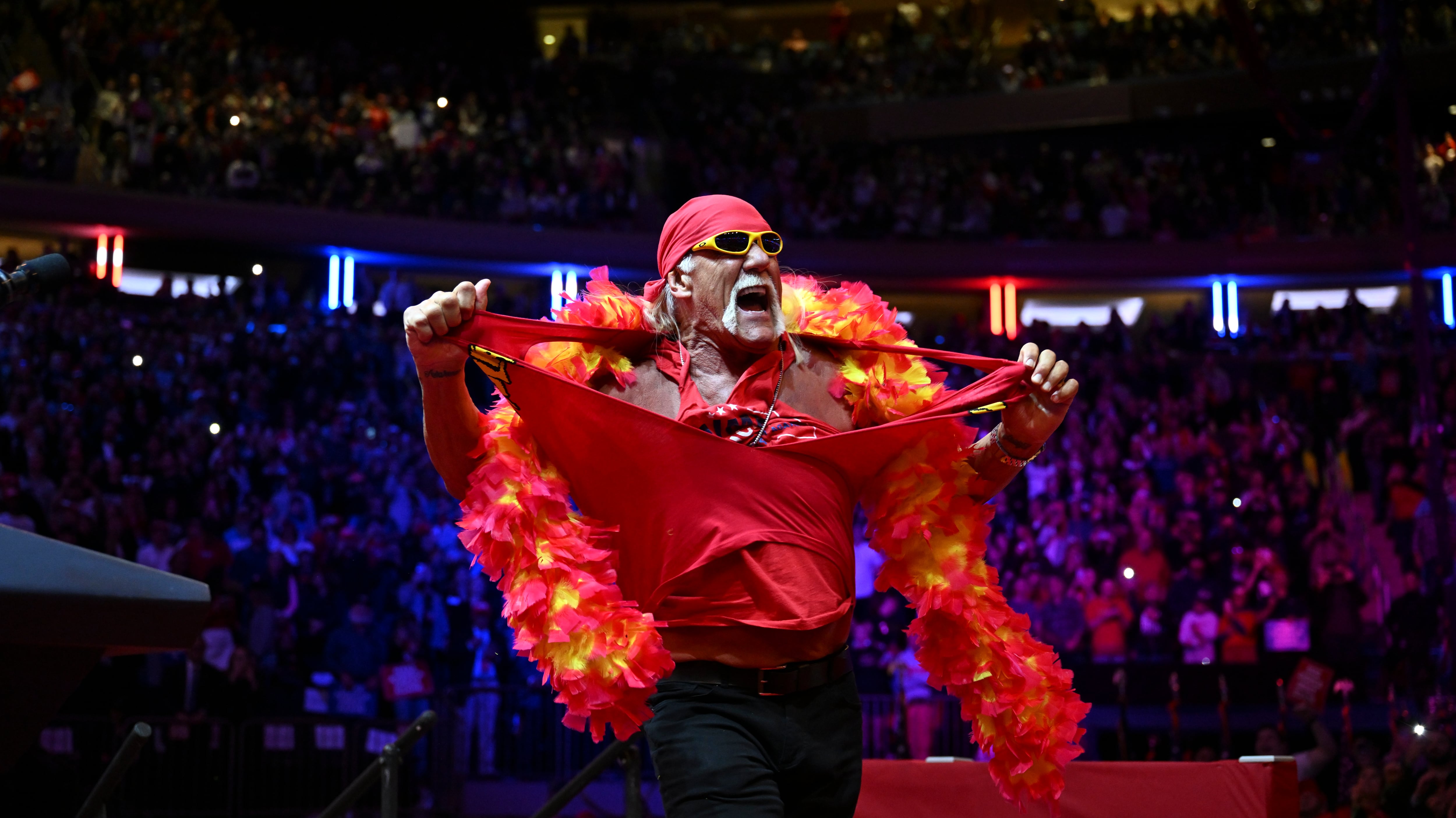 FILE Ñ Hulk Hogan, in the red-and-yellow, boa-and-bandanna attire of his wrestling heyday, takes the stage at a campaign rally for Donald Trump, at Madison Square Garden in New York, on Sunday, Oct. 27, 2024. HoganÕs brand of exaggerated manliness, built on a fight, is a key part of TrumpÕs platform, one of the many outsize hallmarks of the 1980s that the president holds dear, just like HoganÕs ability to command a screen, or play to an audience. (Kenny Holston/The New York Times)