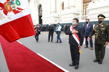 Peru's President Pedro Castillo greets