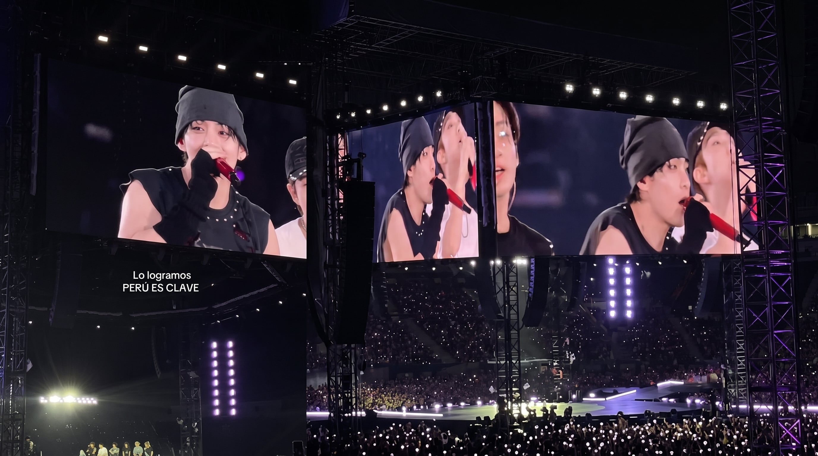 El cantante Taehyung habla ante el público a través de las pantallas gigantes instaladas durante un concierto multitudinario. (Imagen Ilustrativa Infobae)