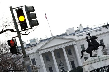 A traffic light signals yellow