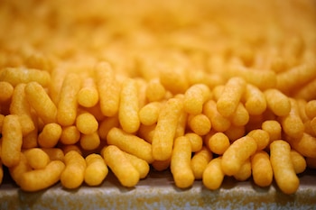 Cheetos Puffs are seen during production at the PepsiCo Walkers factory in Leicester, Britain, July 14, 2024. REUTERS/Hollie Adams