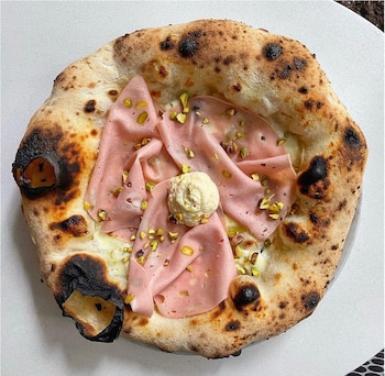 La pizzería utiliza tomates San