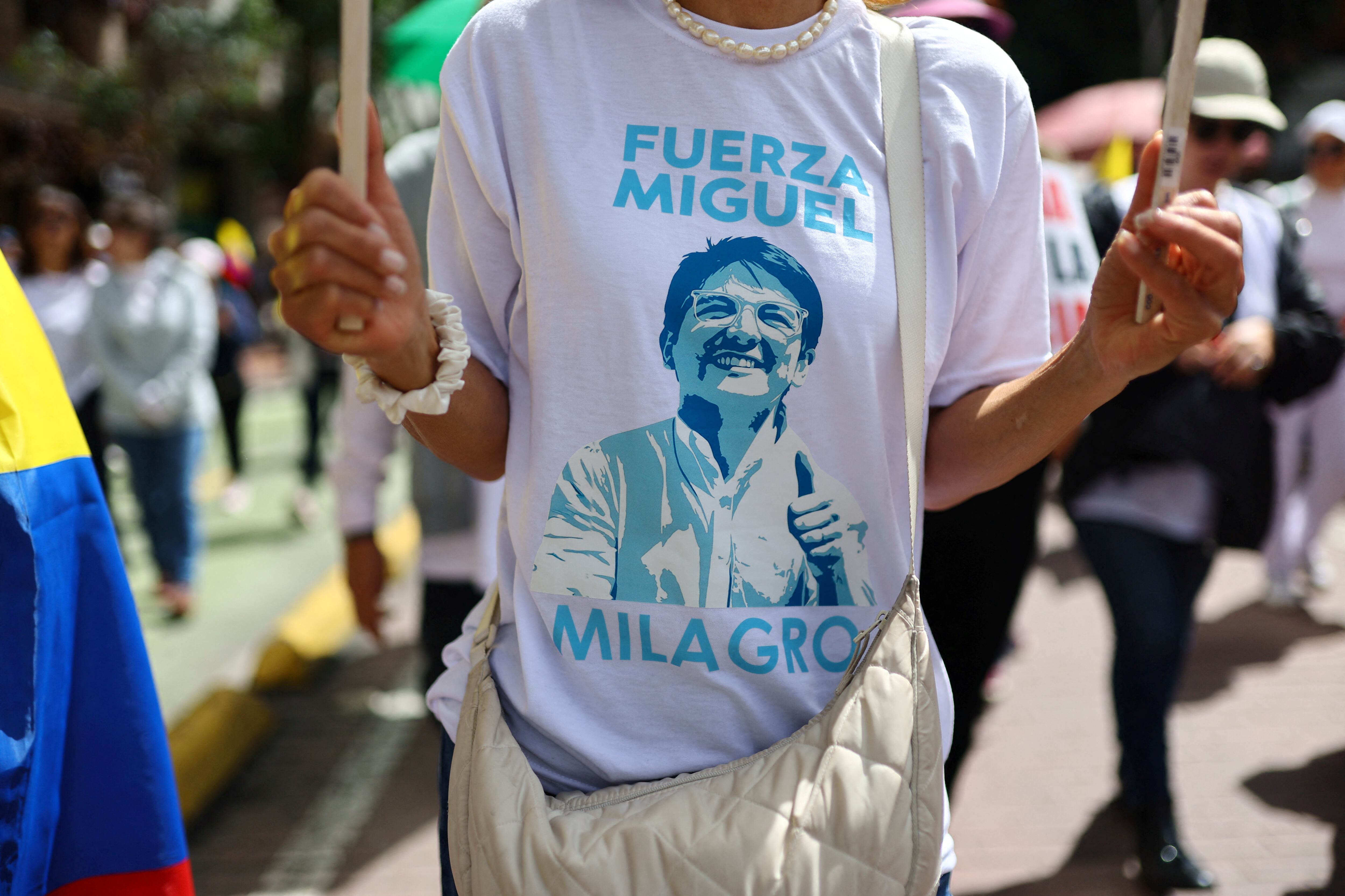 A person wears a t-shirt with an image of Colombian Senator Miguel Uribe Turbaya of the opposition Democratic Center party, during a silent march after the attack on him, in Bogota, Colombia, June 15, 2025. REUTERS/Luisa Gonzalez