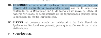 Texto impreso de un documento oficial en español con párrafos numerados en romano y un fragmento destacado en azul