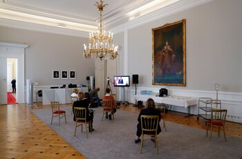 Members of the media follow