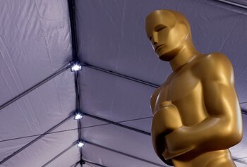 FILE PHOTO: FILE PHOTO: An Oscar statue sits before being placed out for display as preparations for the Academy Awards are underway in Los Angeles, California, U.S., March 24, 2022. REUTERS/Eric Gaillard/File Photo/File Photo
