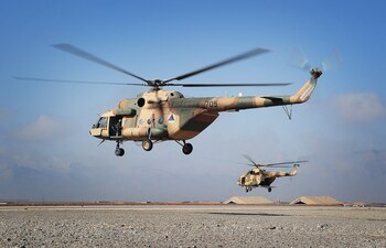 Mi-17 helicopters operated by the 2nd Wing of the Afghan National Army Air Force take off at Multinational Base Tarin Kowt in Uruzgan province, Afghanistan, Feb. 23, 2013. (U.S. Army photo/Released)