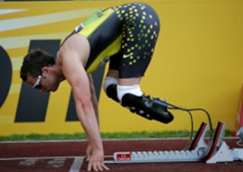 ROME - JULY 13: South African runner Oscar Pistorius settles in the blocks before winning the Mens 400m 'B' race during the IAAF Golden Gala at The Olympic Stadium on July 13, 2007 in Rome, Italy (Photo by Stu Forster/Getty Images) *** Local Caption *** Oscar Pistorius
