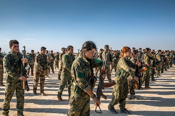 FILE -- Kurdish fighters with