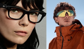 Una mujer usa gafas negras Ray-Ban Meta. Un hombre usa gafas de sol deportivas espejadas Oakley con marco negro y chaqueta naranja. Fondo gris y cielo azul