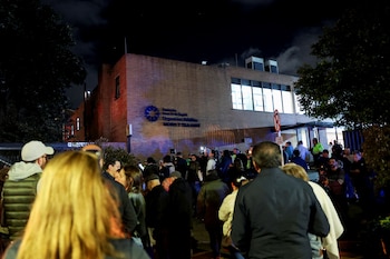 People gather outside Santa Fe