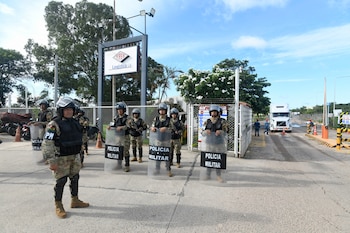 Military personnel guard the Palmasela
