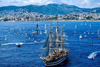 The Ocean Race VO65 Sprint Cup 2022-23 - 1 July 2023. Aerial view IMOCA In-Port Race in Genova. Army F35 planes fly over the Italian Navy Amerigo Vespucio tall ship.